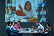 © master1305 - Team members in corporate environment join online video call from office boardroom, discussing project and addressing issues with remote colleagues. Concept of business, communication, teamwork
