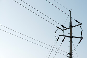 View of the electricity transmission pole in the blue sky