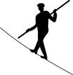Silhouette of ropewalker on rope on a white background.

