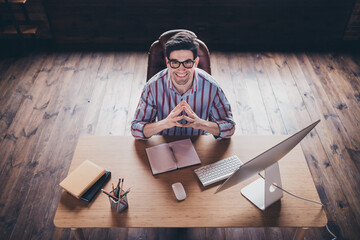 Wall Mural - Above view portrait of young man corporate worker sit chair desktop wear striped shirt modern office home indoors