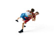 Young male athletes, concentrated wrestlers in motion, competing, demonstrating agility and technique isolated on white background. Combat sport, martial arts, competition, tournament, athleticism