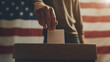 Set against the American flag, a man's hand drops his ballot into the election box, capturing the essence of democratic freedom and civic engagement in a close-up shot resonant wit