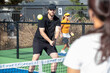 © Mat Hayward - Playing the popular sport pickleball on an outdoor court in the summer.