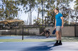 © Mat Hayward - Pickleball players in a game on an outdoor court