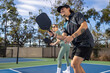 © Mat Hayward - Co-ed pickleball team. The players are active on the court for a fun and fast game.