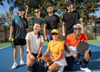© Mat Hayward - Group of seven friends together on pickleball court. The diverse players are laughing and smiling together outside and having fun. Multi-ethnic people and diversity in age and gender.