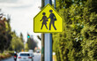 Pedestrians on the road, warning sign, city Vancouver, Canada
