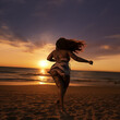 Plump woman dancing on beach
