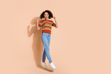 Poster - Full body photo of satisfied girl dressed ornament t-shirt jeans trousers jumping win lottery yell isolated on pastel color background