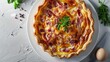 Quiche Lorraine pie with beechwood smoked bacon, creamy Cheddar cheese and free-range egg in shortcrust pastry on a white plate and modern white background. Flat-lay or top view banner with copy space