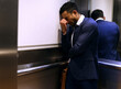 © peopleimages.com - Stress, depression or man cry in elevator for business fail, bankruptcy or recession disaster. Fired, termination or lawyer overthinking resignation mistake, dismissal or anxiety in inflation crisis