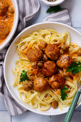 Canvas Print - Chicken meatballs beef stroganoff with pasta.top veiw