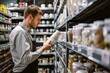Supermarket Employee Stocktaking on Grocery Aisle