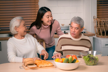 Wall Mural - Asian Family Happiness in the Kitchen: Senior Parents Cooking Dinner with Joy, Children Laughing, A Fun and Loving Atmosphere of Togetherness, Creating Delicious Meals and Beautiful Memories