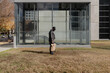 © Zach Lopez/Stocksy - Stylish Man Posing By Architecture With Backpack In Natural Light