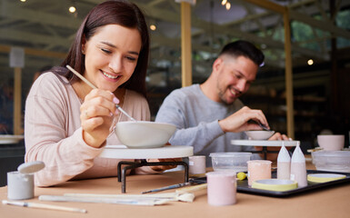 woman, man and paint ceramics for date, art workshop for bonding with paintbrush and material. anniv