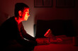 © Pixel Stories/Stocksy - Adult woman using infrared treatment light / lamp at home