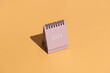 © Pixel Stories/Stocksy - 2024 calendars on orange/peach background