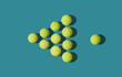 © Yaroslav Danylchenko/Stocksy - Tennis balls arranged in triangle shape as on billiard game