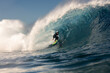 © Adrian Rodd/Stocksy - A skilled professional surfer deftly riding a colossal wave