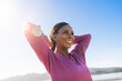 © Christine La/Stocksy - Happy woman hands behind head