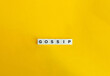 © photoopus - Gossip Word. Idle Talk or Rumor Concept. Text on block letters on bright orange background. Minimal aesthetics.