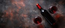 Red Wine Glasses And A Bottle On A Stone Surface With A Top-down Perspective And Available Space For Text.