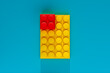 © Marcos Osorio/Stocksy - Yellow and Red Block on Blue Surface