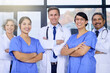 © peopleimages.com - Teamwork, healthcare and portrait of doctors with crossed arms for medical service, insurance or collaboration. Professional, hospital and men and women in clinic for wellness, medicare or consulting