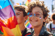 A joyful young individual at a pride parade, holding an LGBTQ+ flag, embodying celebration and diversity.