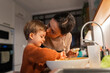 © Santi Nuñez/Stocksy - family cooking in the home kitchen