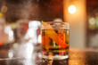 Elegant Cocktail with Orange Peel in Atmospheric Bar
