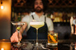 Bartender Serving Stylish Cocktails at Modern Bar