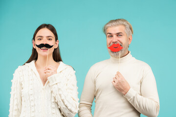 Gender concept. Couple of woman with moustache and man with red lips. Gender equality. Transgender gender identity, equality and human rights.