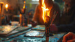 A torch burning brightly up close. encased by artists sitting around a studio table with canvases and paintbrushes on it