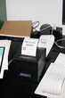 © Guille Faingold/Stocksy - Receipt thermal printer in operation