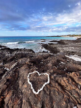 Heart Made With Coral On A Scenic Rocky Beach In Hawaii