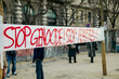© Laura Stolfi/Stocksy - 'Stop genocide' words written on an hanging banner in town