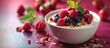 Bowl of Yogurt With Raspberries and Blueberries