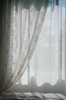 © Maryanne Gobble/Stocksy - Lace Curtain and Window Sunlight