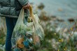 © Vladan - An environmental volunteer collects scattered litter into a plastic bag, contributing to conservation efforts by a lake.