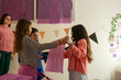 © Eloisa Ramos/Stocksy - preteenagers Room Decoration Teamwork