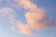 © Helen Rushbrook/Stocksy - Peachy clouds in a blue sky