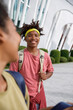 © Jovo Jovanovic/Stocksy - Happy high school friends walking on campus