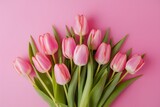 Fototapeta Tulipany - Vibrant pink tulip bouquet as a Mothers Day backdrop