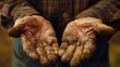 © Justlight - A closeup of an older mans hands strong and weathered worn from a lifetime of hard work and perseverance. .