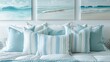 A set of luxurious light blue and white striped pillows tered on a crisp white bed surrounded by oceaninspired artwork depicting sandy beaches aquamarine waters and graceful seagulls. .