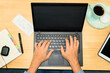 © Ángela Rober/Stocksy - Busy Workspace with Laptop and Coffee