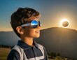 A young boy safely looks at a total eclipse while wearing protective glasses.