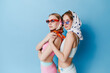 © Serge Filimonov/Stocksy - Studio portrait of sisters in summer outfit